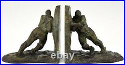Art Deco French bronze bookends two men pushing Victor Demanet 1925