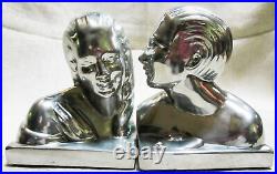 Art Deco bookends of Lovers in polished aluminum 5-1/4 tall a pair USA