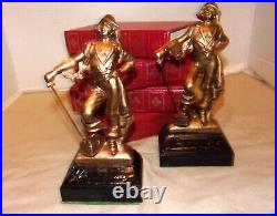 Pair 1920's Solid Bronze Dodge, Inc. Pirate Bookends withBlack Enamel Bases