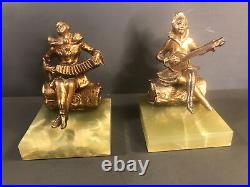 Pair of Art Deco bookends/Music/Onyx marble base/Gilt white metal/ C. 1940/Clown